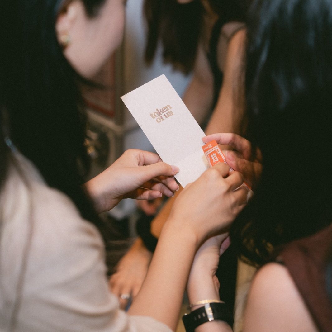 guest holding the stickers